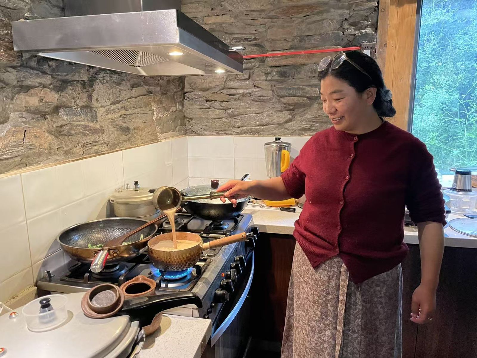 Our host at Duopu Nuozi — with no restaurant in the village, dinner is whatever she decides to cook